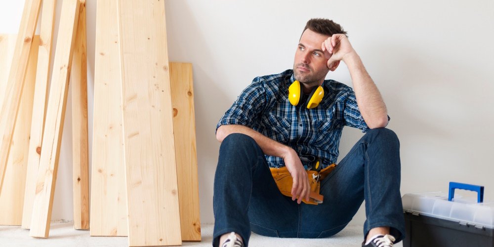 couple deciding if they want to renovate themselves or hire a contractor for home improvement